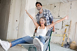 Loving couple is having fun while they are renovating house photo