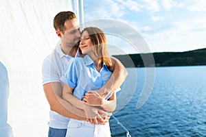 Loving Couple Hugging Enjoying Romantic Yacht Tour On Vacation