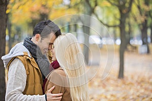 Loving couple hugging in park