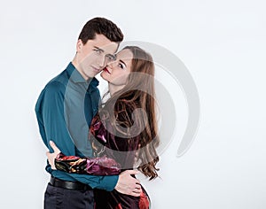 Loving couple hugging on a white background