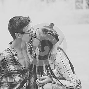 Loving couple kiss teenagers.