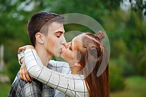 Loving couple kiss teens.