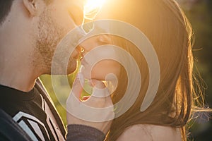 Loving couple kissing outdoor at sunset, love and lifestyle. Sensual kiss. Young couple kisses, Sexy lovers. photo