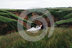 Loving couple lies on a grass