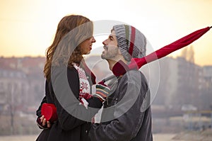 Loving couple looking at each others eyes outdoors