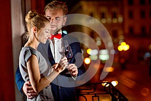 Loving couple on the night city background