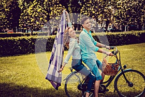 Loving couple on one bicycle