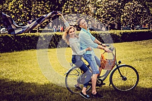 Loving couple on one bicycle