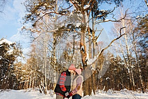 Loving couple posing in winter forest