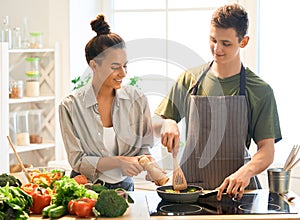 Loving couple is preparing the proper meal
