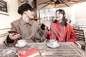 Loving couple quarrel at the bar.