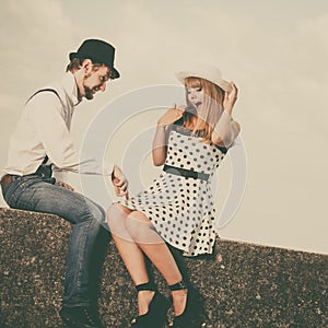 Loving couple retro style dating on sea coast