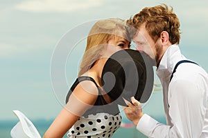 Loving couple retro style kissing on date outdoor