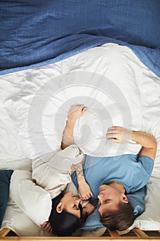 Loving Couple Sleeping in Bed