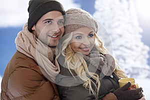 Loving couple embracing at wintertime photo