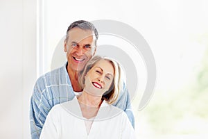 Loving couple - Smiling mature man embracing woman from back. Portrait of a smiling mature man embracing woman from back