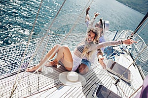 Loving couple spending happy time on a yacht at sea.