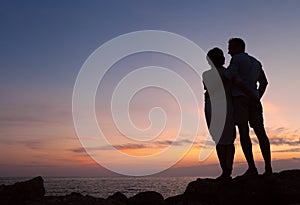 Loving couple sunset silhouette