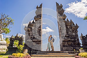 Loving couple of tourists in budhist temple Brahma Vihara Arama Banjar Bali, Indonesia. Honeymoon