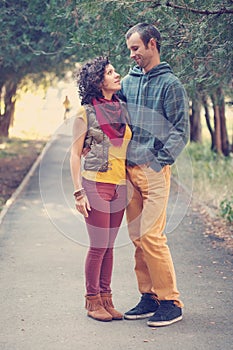 Loving couple walking and hugging in the park