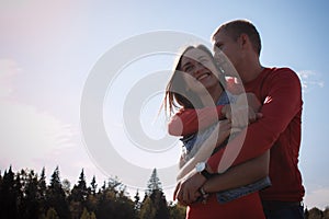 The loving couple walks on the wheat field