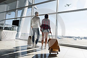 Loving couple watching aircraft flight