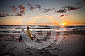 Loving couple watching sunset