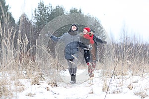 Loving couple in winter forest