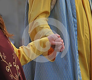 loving couples holding hands in medieval clothes