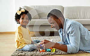 Loving Dad Enjoying Making Development Activities With Toddler Child Daughter