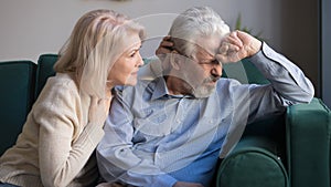 Loving elderly wife comfort supporting senior sad husband