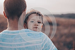 Loving family. Father and his son baby boy playing and hugging outdoors. Happy dad and son outdoors. Concept of Father`s day.