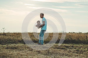 Loving family. Father and his son baby boy playing and hugging outdoors. Happy dad and son outdoors. Concept of Father`s day.