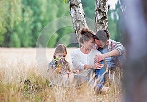 Loving family together in a park, field or woodlands