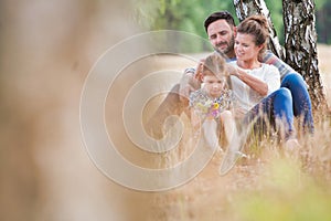 Loving family together in a park, field or woodlands