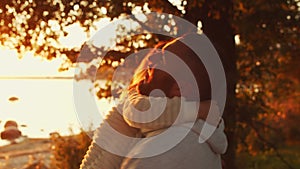 Loving family walks in the countryside during sunset. Father plays with his daughter. The concept of love, parental care