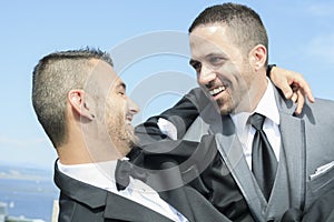 Loving gay male couple on their wedding day