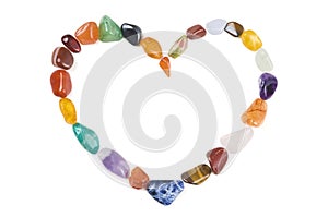 Loving Gems - Luxury heart shape made of mixed semi-precious gem stones on white background with shadow. Design element for love