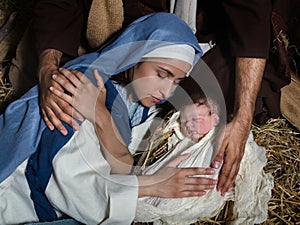 Loving hands in nativity scene