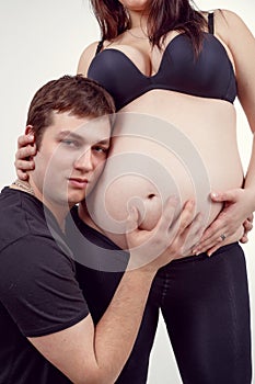 Loving happy couple pregnant woman with her husband