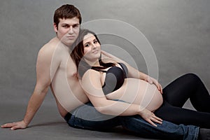 Loving happy couple, pregnant woman with her husband