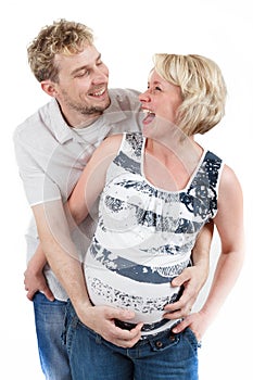 Loving happy couple, smiling pregnant woman with her husband