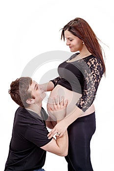 Loving happy couple, smiling pregnant woman with her husband