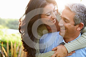 Loving Hispanic Couple In Countryside