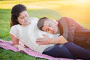 Loving Hispanic Pregnant Young Couple Portrait Outdoors