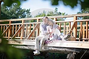 Loving husband hugging wife while enjoying day outdoors