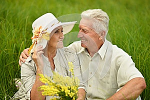 Loving mature couple in the park in summer