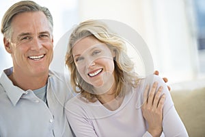 Loving Mature Couple Smiling At Home