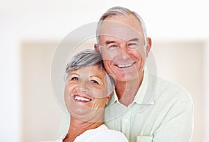 Loving mature couple smiling together. Closeup portrait of loving mature couple smiling together.