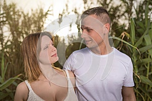 Loving man and happy woman in a spring blooming park. Happy mature couple in love embracing outdoor